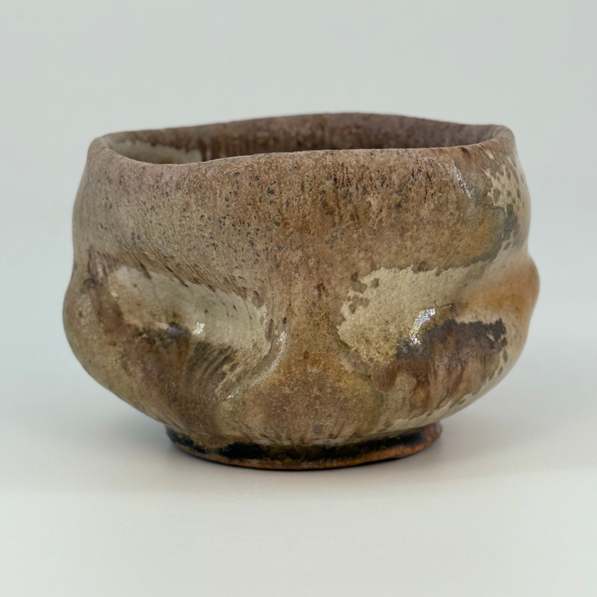 Brown ceramic bowl on a white background