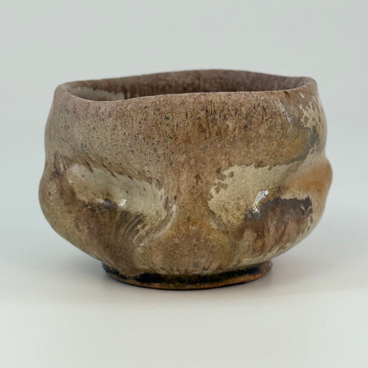 Brown ceramic bowl on a white background